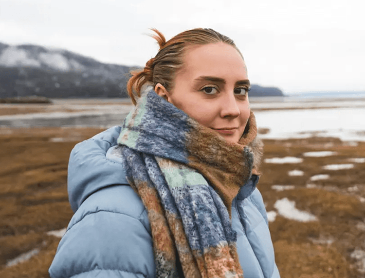 Tilt her head towards the camera